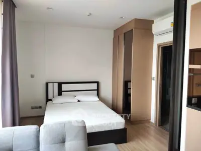 Modern bedroom with sleek design and ample natural light