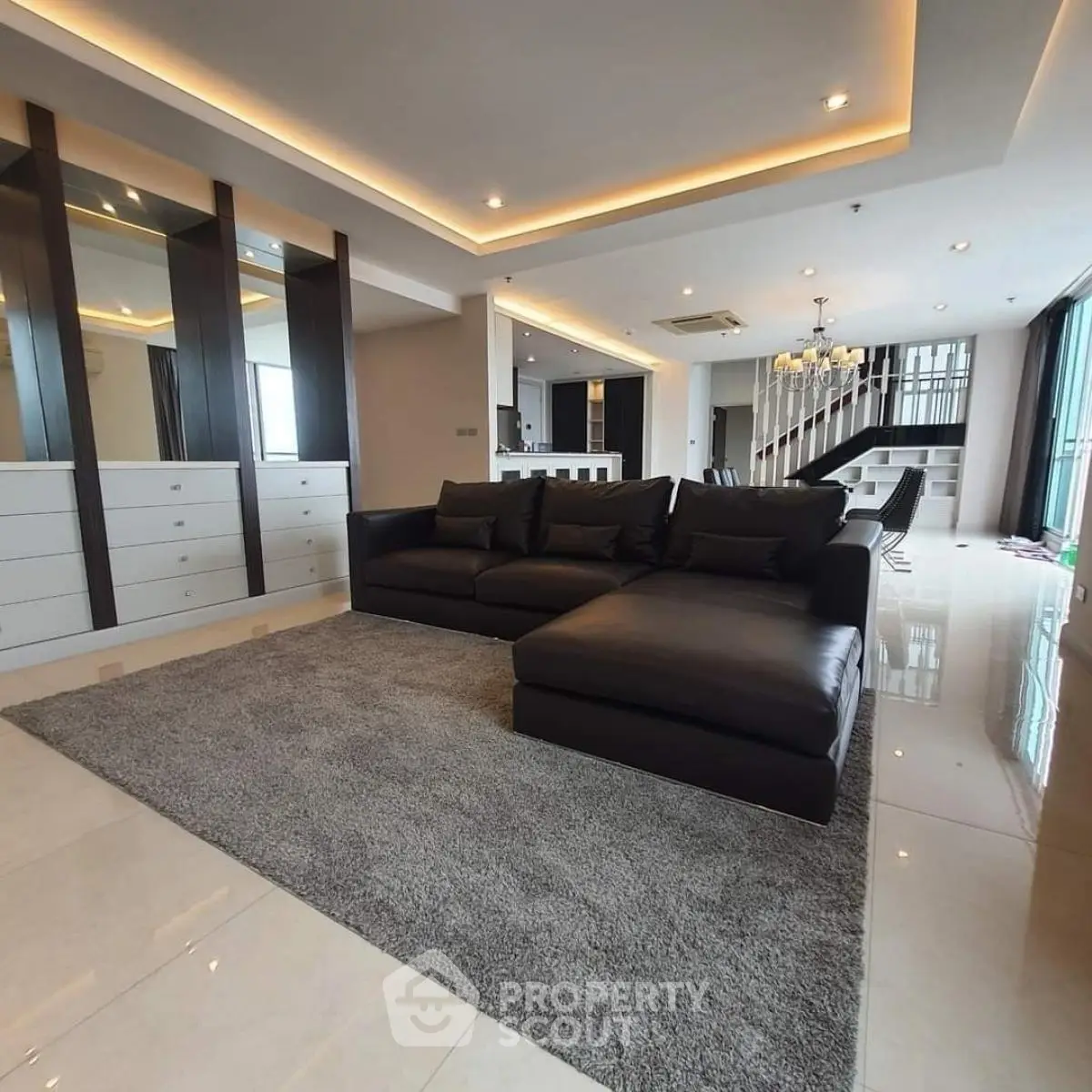 Luxurious modern living room with elegant black sofa and stylish decor
