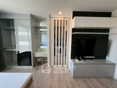 Modern living room with sleek TV unit and stylish decor