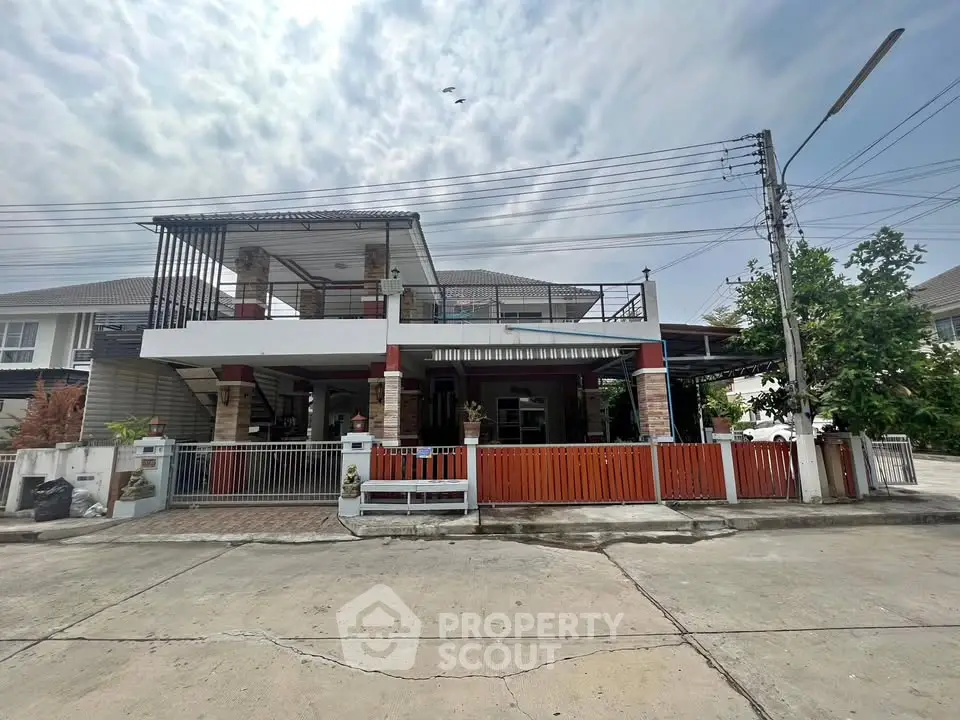 Charming two-story house with spacious balcony and modern design in a serene neighborhood.