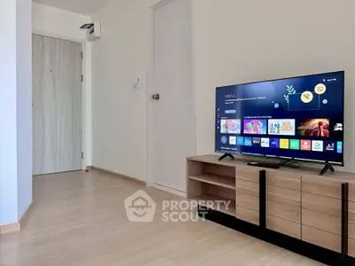 Modern living room with sleek TV stand and smart TV setup.
