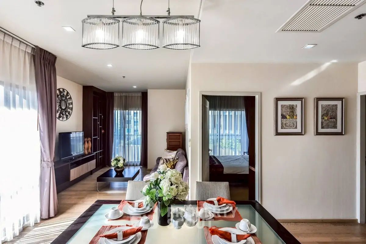 Elegant open-plan living and dining area with modern decor and natural light