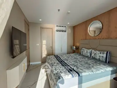 Modern bedroom with stylish decor and ample natural light