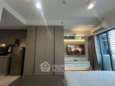 Modern bedroom with sleek design, built-in wardrobe, and a cozy ambiance.