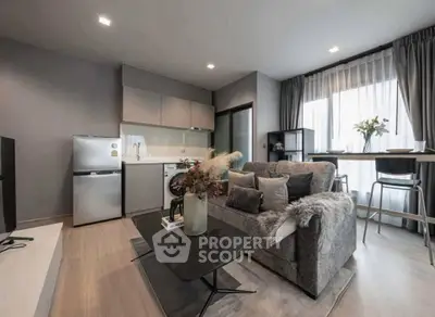Modern living room with stylish decor and open kitchen layout