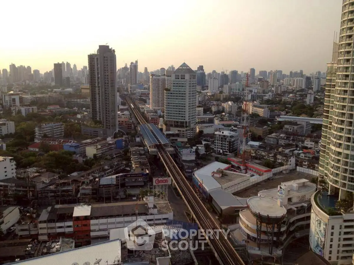 Stunning cityscape view showcasing urban skyline and high-rise buildings at sunset.