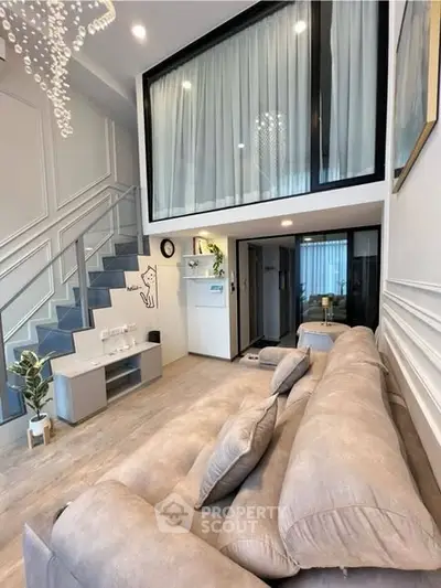 Modern duplex living room with stylish decor and mezzanine level