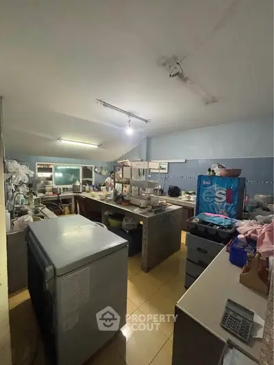 Spacious kitchen with ample storage and modern appliances, perfect for culinary enthusiasts.