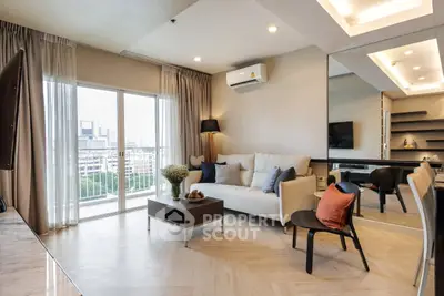 Modern living room with large window and city view, featuring stylish furniture and elegant decor.
