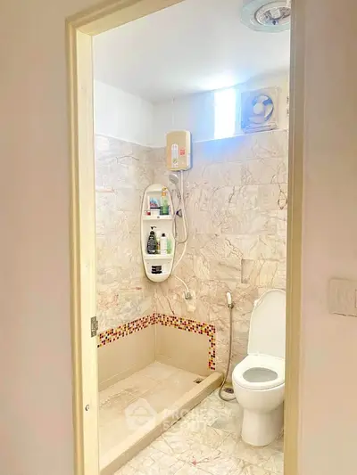 Cozy bathroom with modern shower and elegant tile design, perfect for a relaxing home retreat.