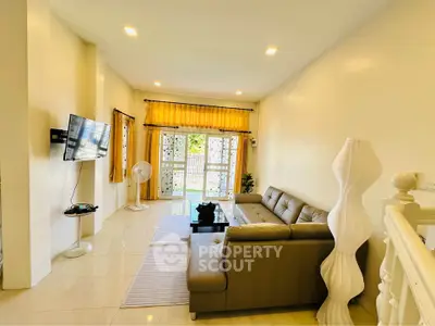 Spacious living room with modern decor and natural light