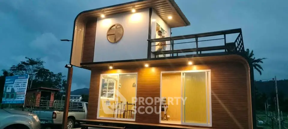Modern tiny house with stylish exterior and balcony, perfect for minimalist living.