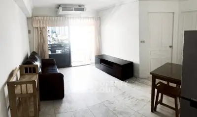 Spacious living room with modern furniture and city view balcony