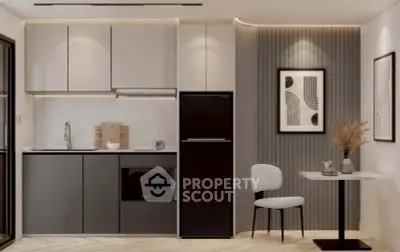 Modern kitchen with sleek cabinetry and integrated appliances in stylish apartment.