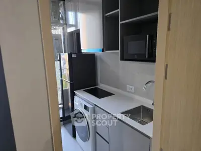 Modern compact kitchen with sleek appliances and efficient layout