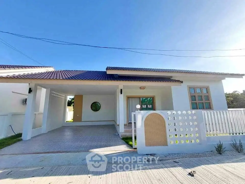 Modern single-story house with spacious carport and stylish facade