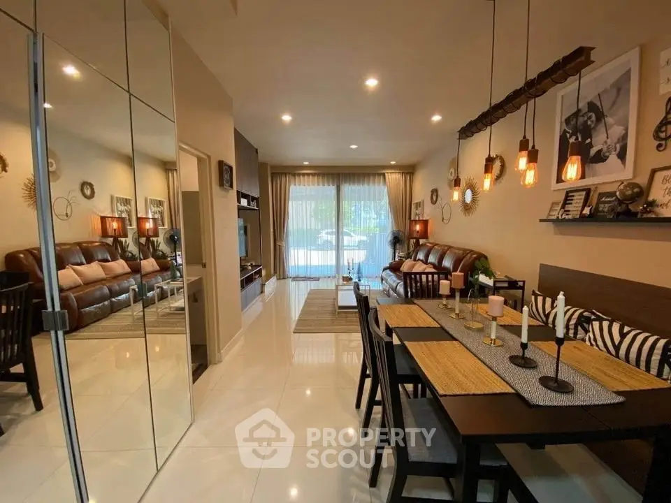 Spacious modern living and dining area with elegant decor and ample natural light.
