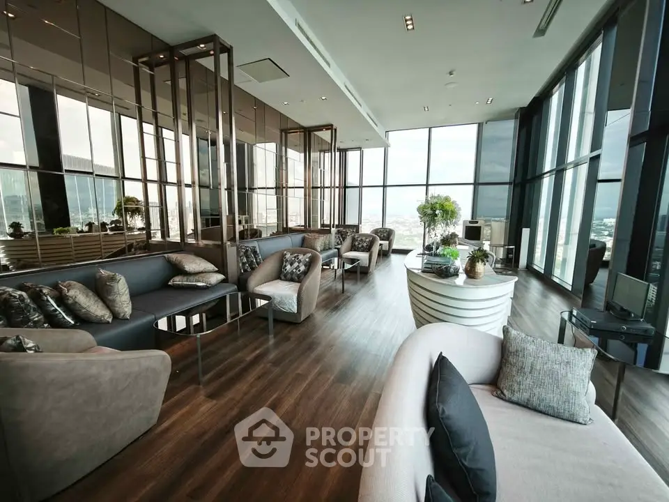 Luxurious high-rise living room with panoramic city views and modern decor.