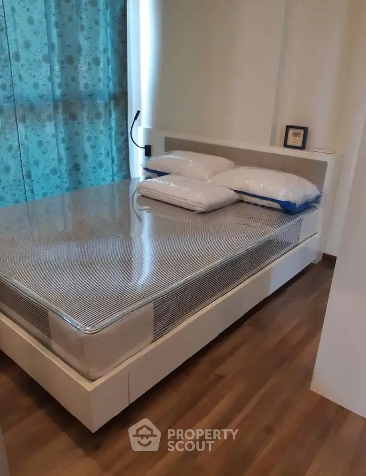 Cozy bedroom with modern bed and stylish decor, perfect for relaxation and comfort.