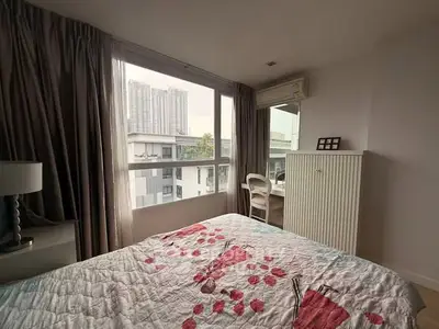 Cozy bedroom with city view and modern decor