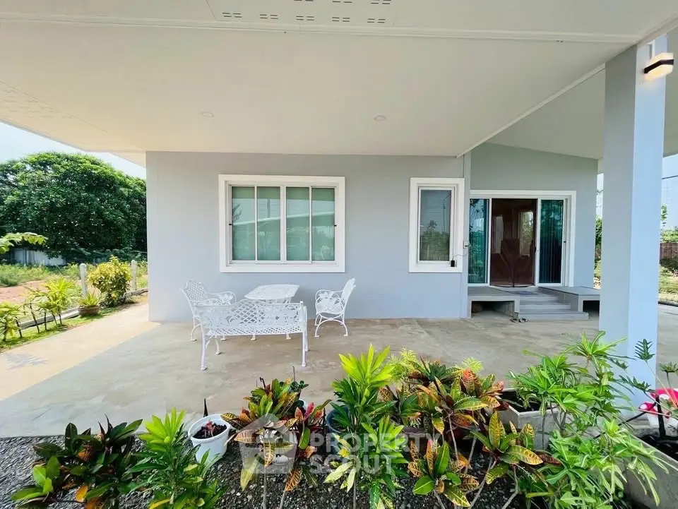 Charming modern home with spacious patio and lush garden, perfect for outdoor relaxation and entertaining.