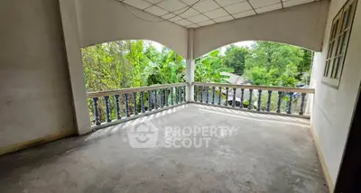 Spacious balcony with lush green views, perfect for relaxation and outdoor enjoyment.