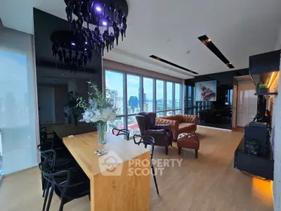 Luxurious modern living room with panoramic city views and elegant furnishings.