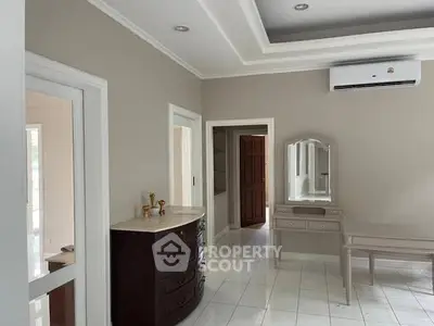 Elegant bedroom with classic furniture and air conditioning in a modern home.