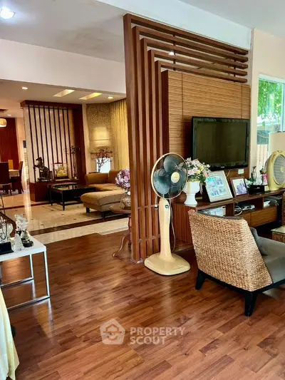 Spacious living room with wooden flooring and modern decor
