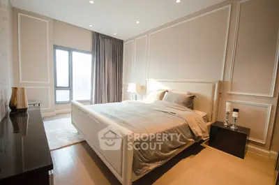 Luxurious modern bedroom with elegant decor and large window view