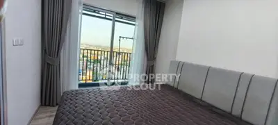 Modern bedroom with city view balcony in high-rise apartment