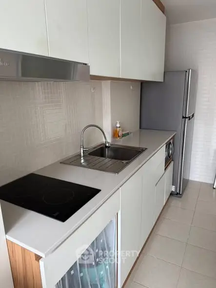Modern kitchen with sleek cabinetry and stainless steel appliances
