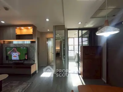 Modern living room with open layout and stylish lighting in a contemporary apartment.