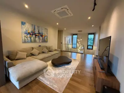 Spacious modern living room with elegant decor and large sectional sofa