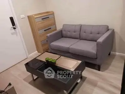 Cozy living room with modern gray sofa and stylish coffee table