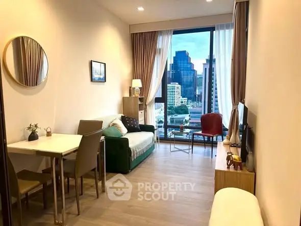 Modern living room with city view, stylish decor, and cozy seating area.