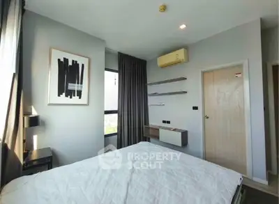 Modern bedroom with minimalist decor and natural light