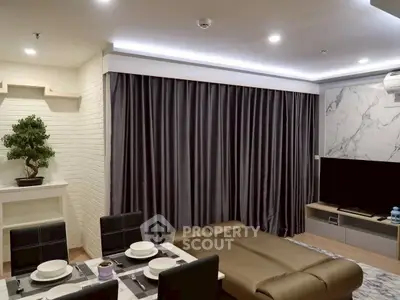 Modern living room with elegant decor and cozy seating area
