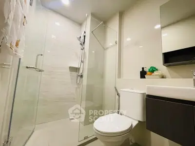 Modern bathroom with glass shower and sleek fixtures