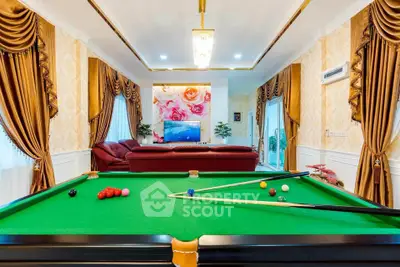 Luxurious living room with pool table and elegant decor
