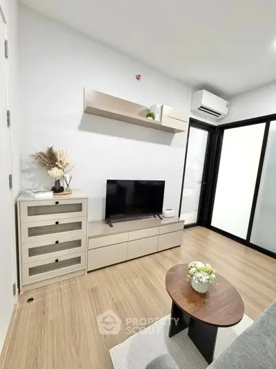 Modern living room with sleek furniture and air conditioning, perfect for cozy relaxation.