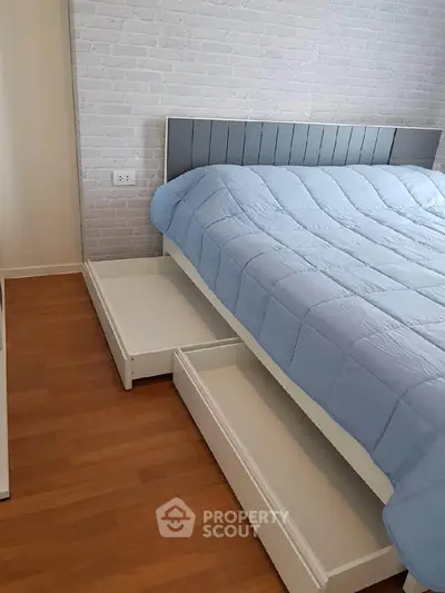 Modern bedroom with stylish bed and under-bed storage drawers