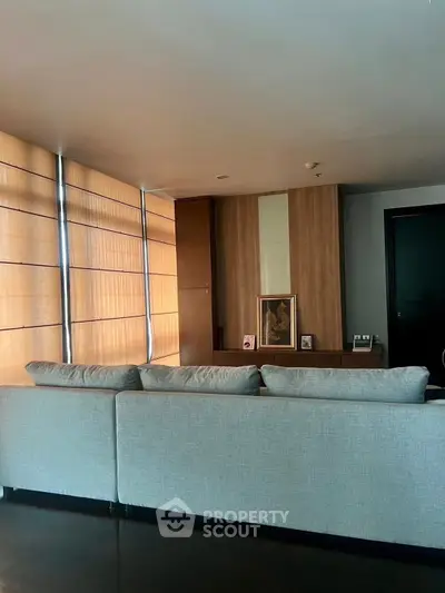 Modern living room with stylish decor and large windows