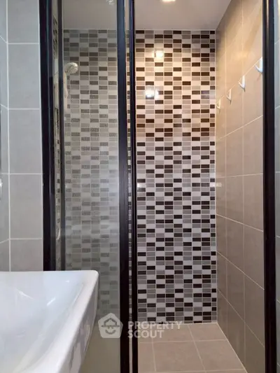 Modern bathroom with stylish tile design and sleek fixtures