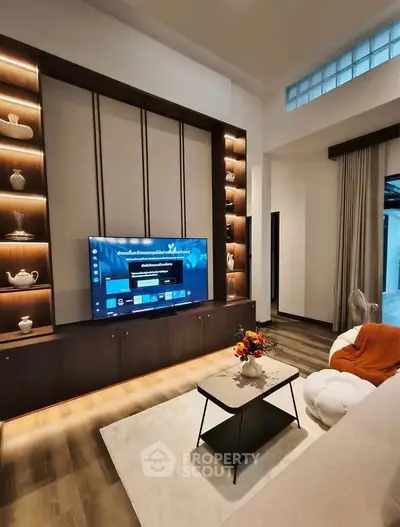 Modern living room with stylish TV wall unit and cozy seating area