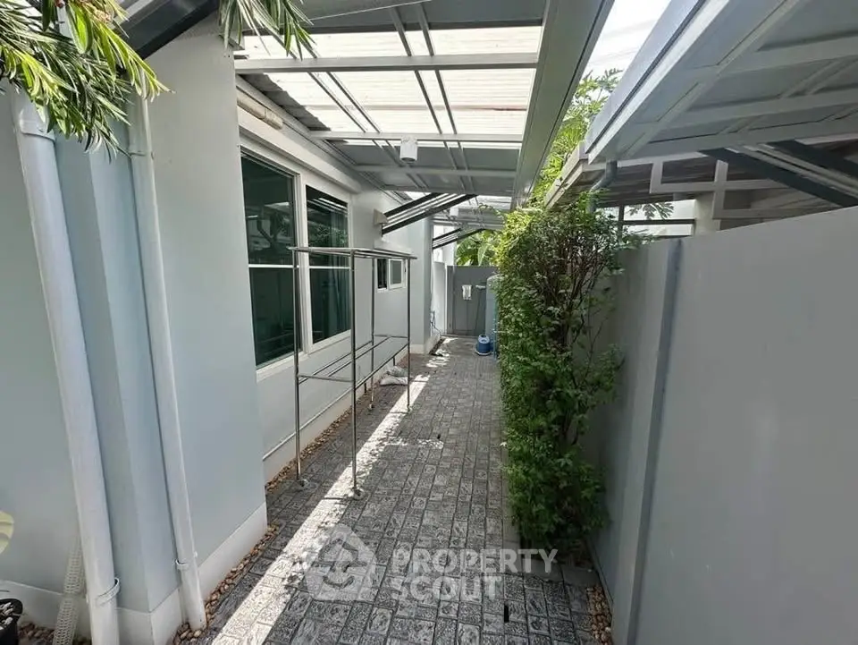 Charming outdoor corridor with modern design and lush greenery