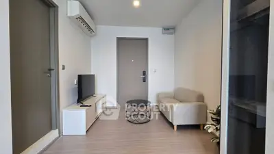Modern living room with sleek furniture and air conditioning in a stylish apartment.