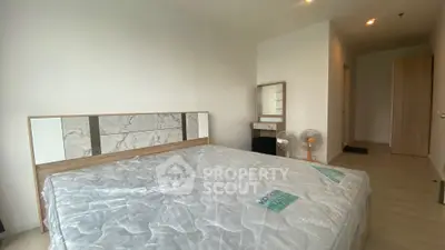 Spacious bedroom with modern design and natural light