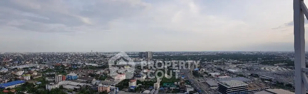 Stunning panoramic cityscape view from high-rise building showcasing urban landscape.