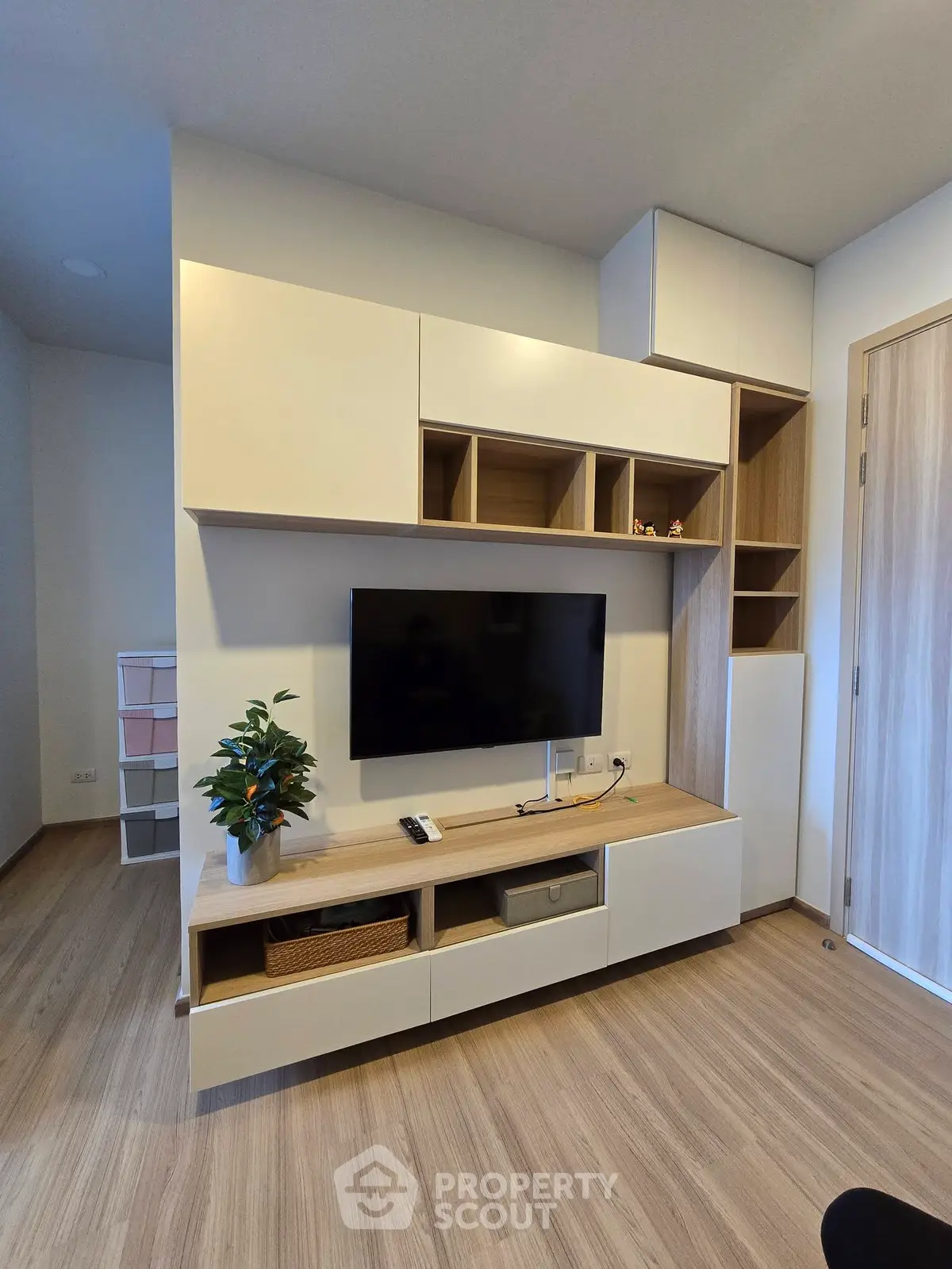 Modern living room with sleek built-in entertainment unit and stylish decor